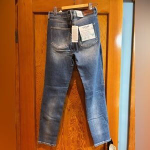 Brand new, never worn Guess hi-rise skinny jeans with gentle distressing